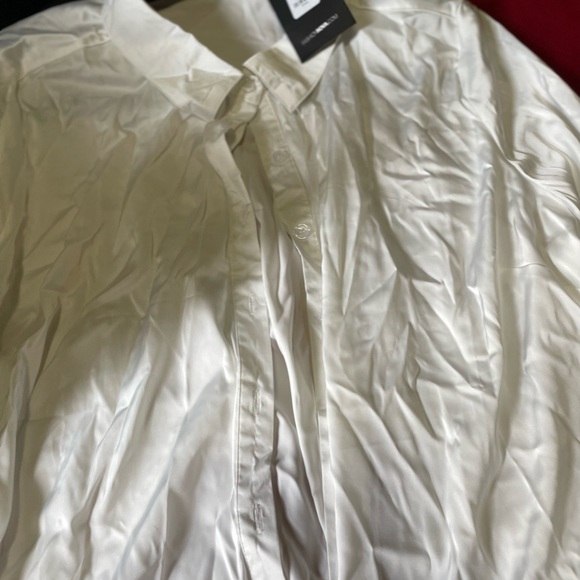 A satin blouse. - Picture 3 of 8